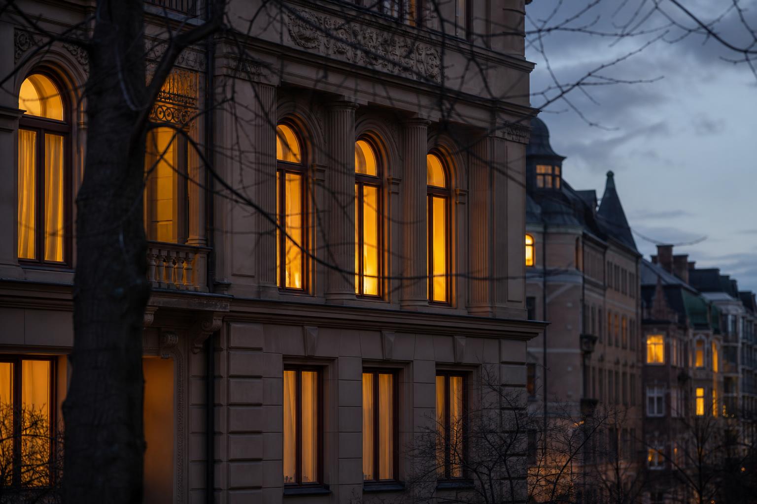 Ireland House Stockholm at evening, warm light through tall arched windows